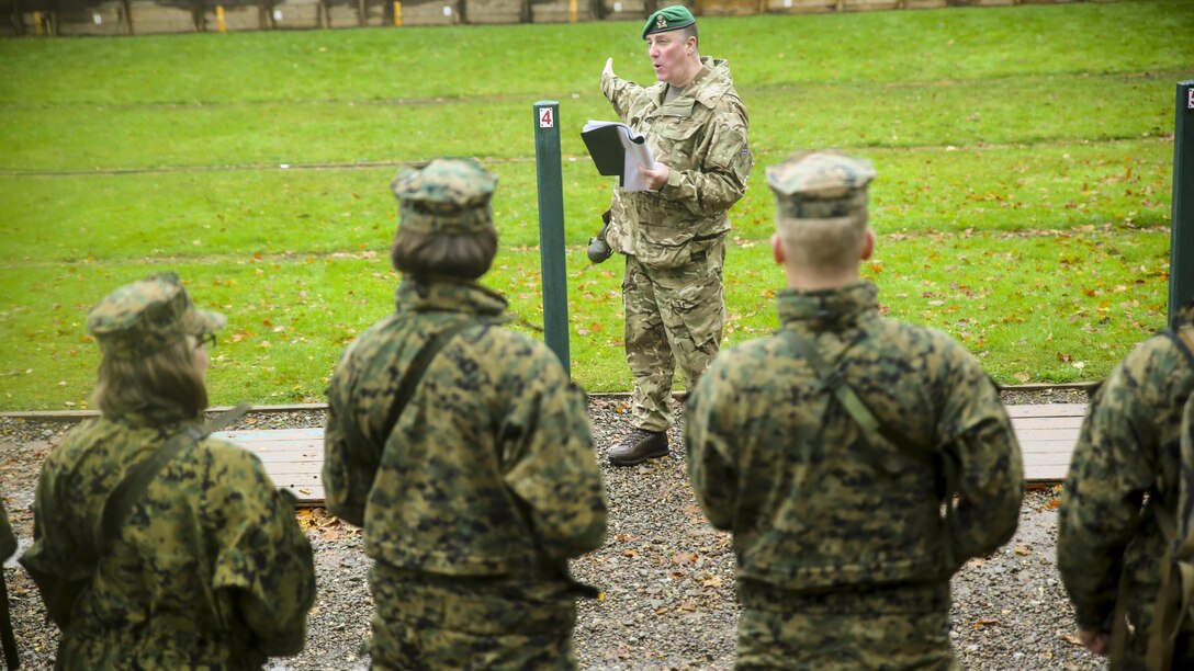 U.S. Marines with 2nd Intelligence Battalion and British soldiers get briefed before conducting a range in Edinburgh, U.K., Nov. 4, 2015. The service members participated in a shooting competition as part of Exercise Phoenix Odyssey II, which builds joint intelligence operations and basic military skills.