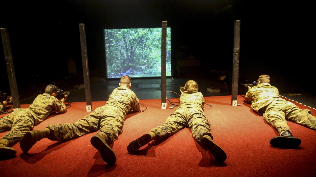 U.S. Marines with 2nd Intelligence Battalion and British soldiers rehearse combat scenarios at a Digital Combat Simulator in Edinburgh, U.K., Nov. 4, 2015. The scenario helped service members practice their shooting, communication and decision making skills to better prepare them for real life confrontations, and ultimately enhance interoperability. The forces conducted Exercise Phoenix Odyssey II which helped increase joint intelligence operations and military skills. 