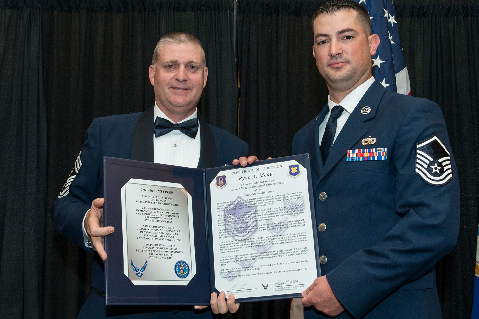 U.S. Air Force Master Sgt. Ryan Meaux is presented the Certificate of Induction during a ceremony on Nov. 7, 2015, Shreveport, La. The 307th Bomb Wing Senior Noncommissioned Officer Induction Ceremony is an annual event held to recognize Airmen who were recently promoted to the rank of Master Sergeant. (U.S. Air Force photo by Master Sgt. Greg Steele/Released)