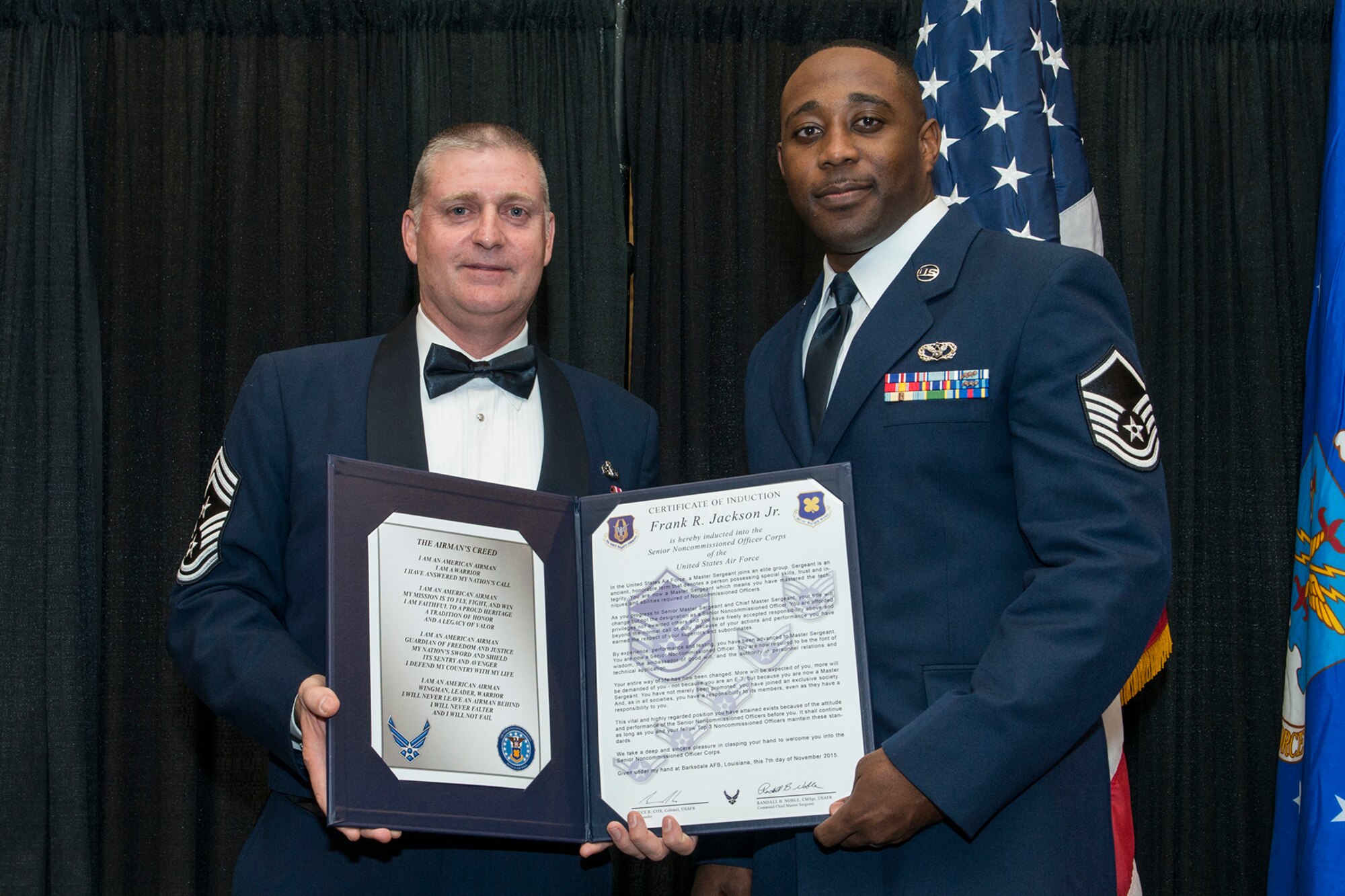 U.S. Air Force Master Sgt. Frank Jackson Jr. is presented the Certificate of Induction during a ceremony on Nov. 7, 2015, Shreveport, La. The 307th Bomb Wing Senior Noncommissioned Officer Induction Ceremony is an annual event held to recognize Airmen who were recently promoted to the rank of Master Sergeant. (U.S. Air Force photo by Master Sgt. Greg Steele/Released)