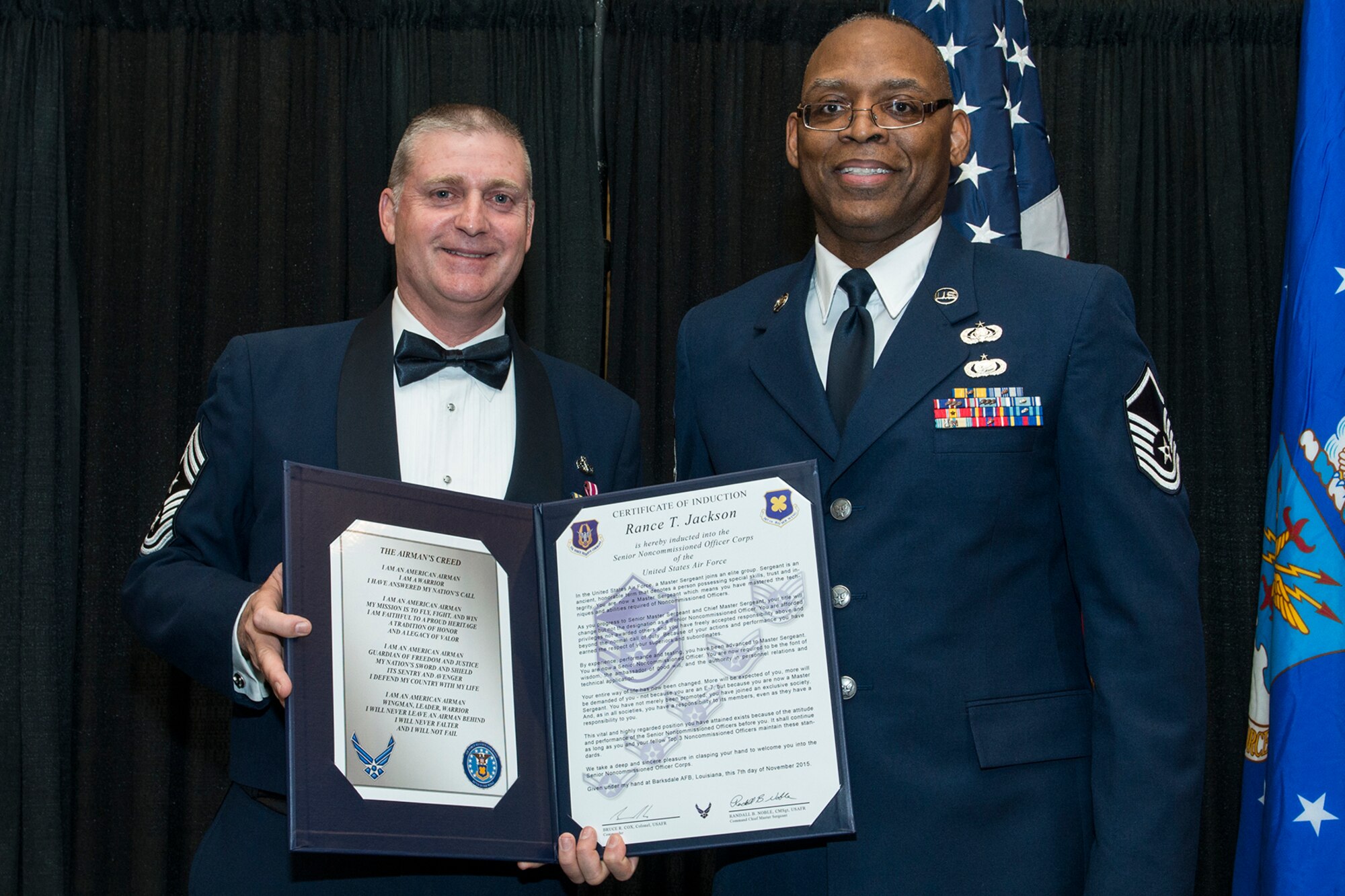 U.S. Air Force Master Sgt. Rance Jackson is presented the Certificate of Induction during a ceremony on Nov. 7, 2015, Shreveport, La. The 307th Bomb Wing Senior Noncommissioned Officer Induction Ceremony is an annual event held to recognize Airmen who were recently promoted to the rank of Master Sergeant. (U.S. Air Force photo by Master Sgt. Greg Steele/Released)