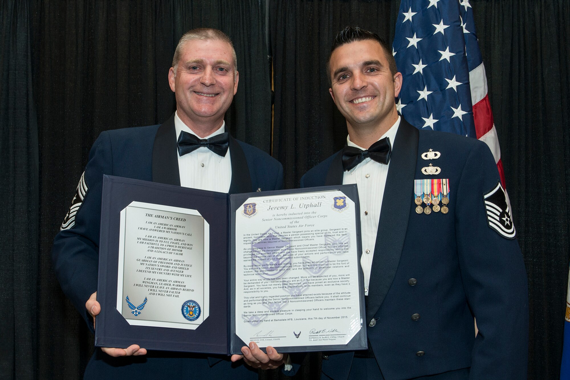U.S. Air Force Master Sgt. Jerry Utphall is presented the Certificate of Induction during a ceremony on Nov. 7, 2015, Shreveport, La. The 307th Bomb Wing Senior Noncommissioned Officer Induction Ceremony is an annual event held to recognize Airmen who were recently promoted to the rank of Master Sergeant. (U.S. Air Force photo by Master Sgt. Greg Steele/Released)