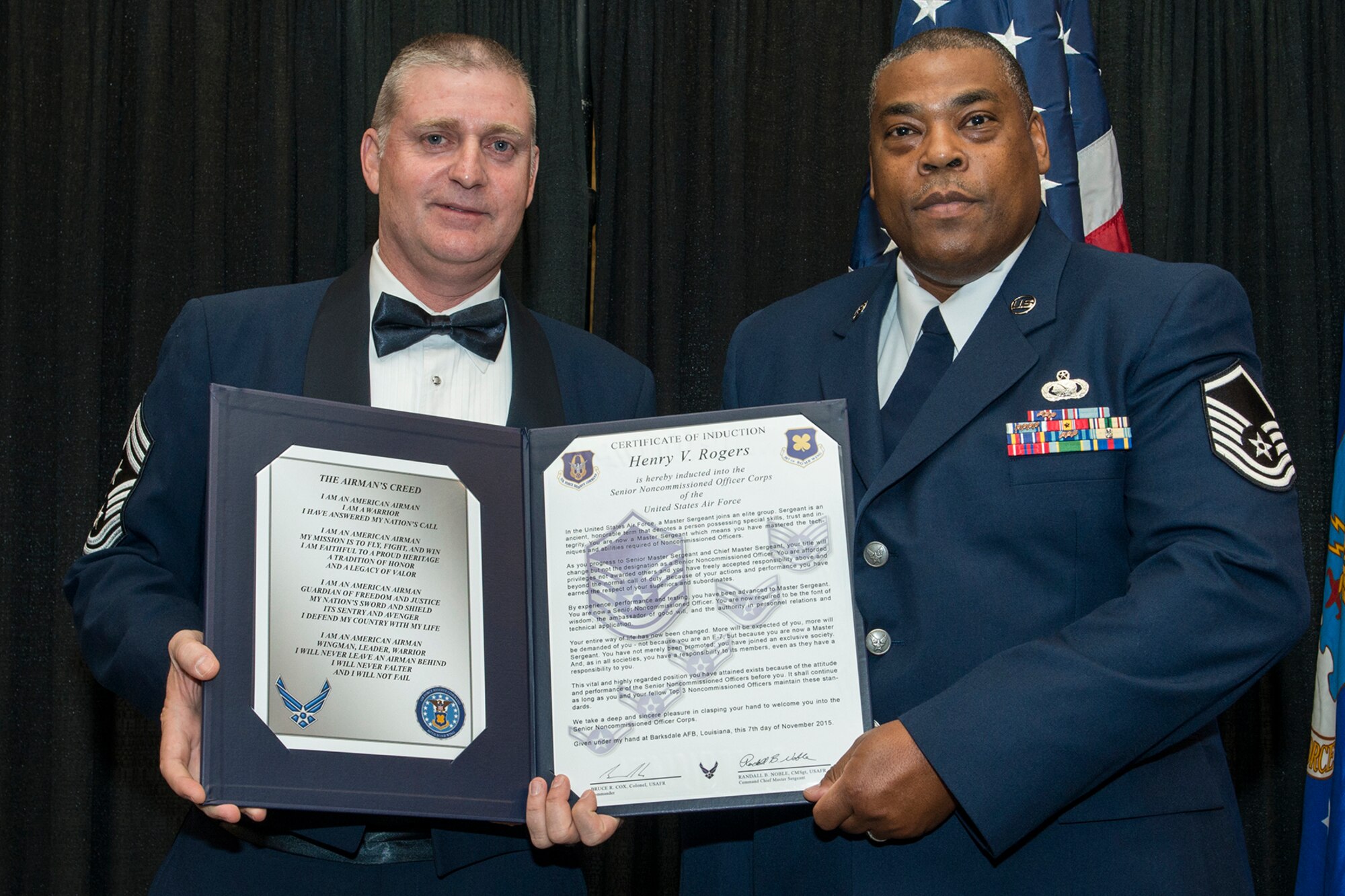U.S. Air Force Master Sgt. Henry Rogers is presented the Certificate of Induction during a ceremony on Nov. 7, 2015, Shreveport, La. The 307th Bomb Wing Senior Noncommissioned Officer Induction Ceremony is an annual event held to recognize Airmen who were recently promoted to the rank of Master Sergeant. (U.S. Air Force photo by Master Sgt. Greg Steele/Released)