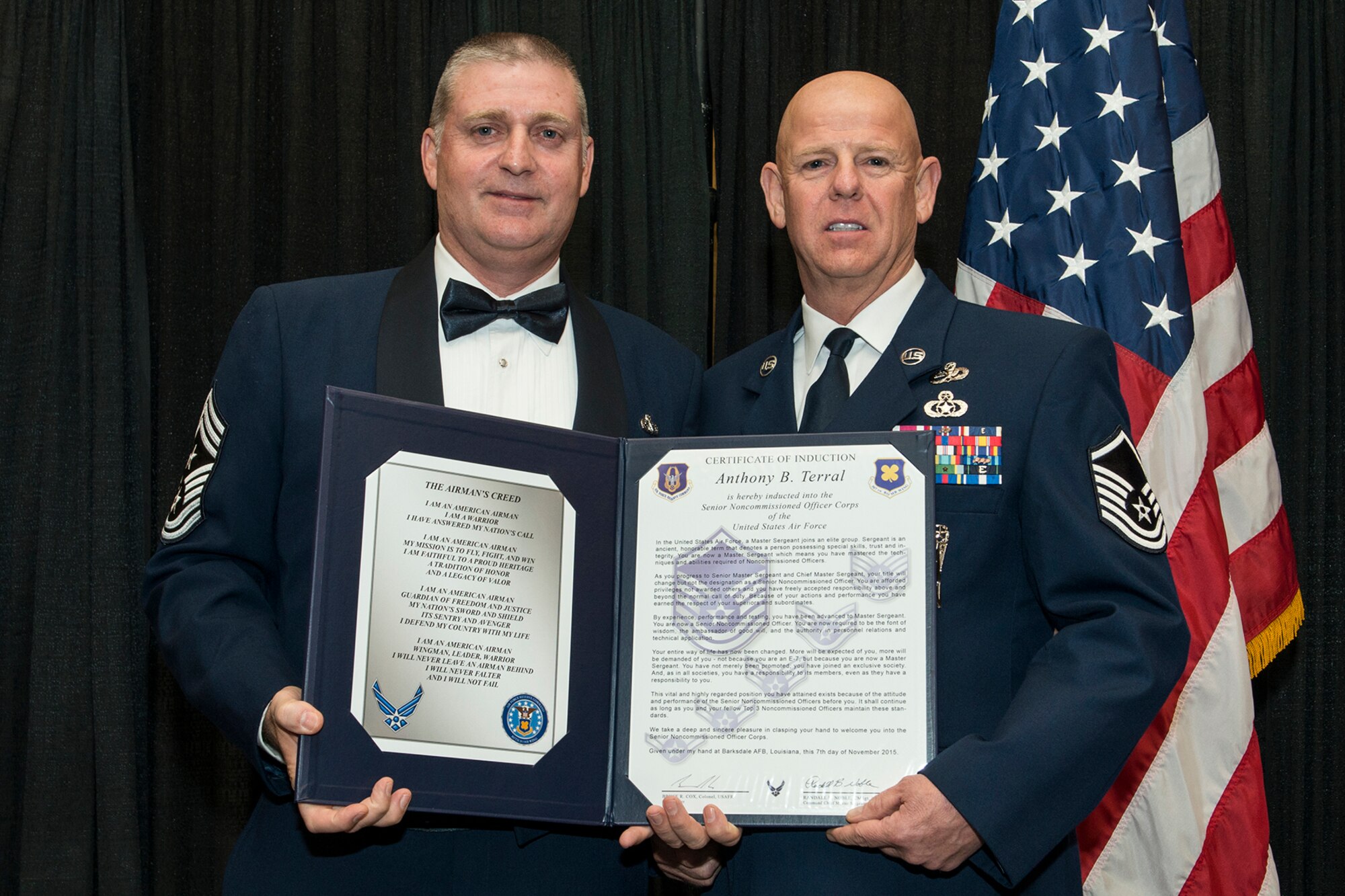 U.S. Air Force Master Sgt. Anthony Terral is presented the Certificate of Induction during a ceremony on Nov. 7, 2015, Shreveport, La. The 307th Bomb Wing Senior Noncommissioned Officer Induction Ceremony is an annual event held to recognize Airmen who were recently promoted to the rank of Master Sergeant. (U.S. Air Force photo by Master Sgt. Greg Steele/Released)