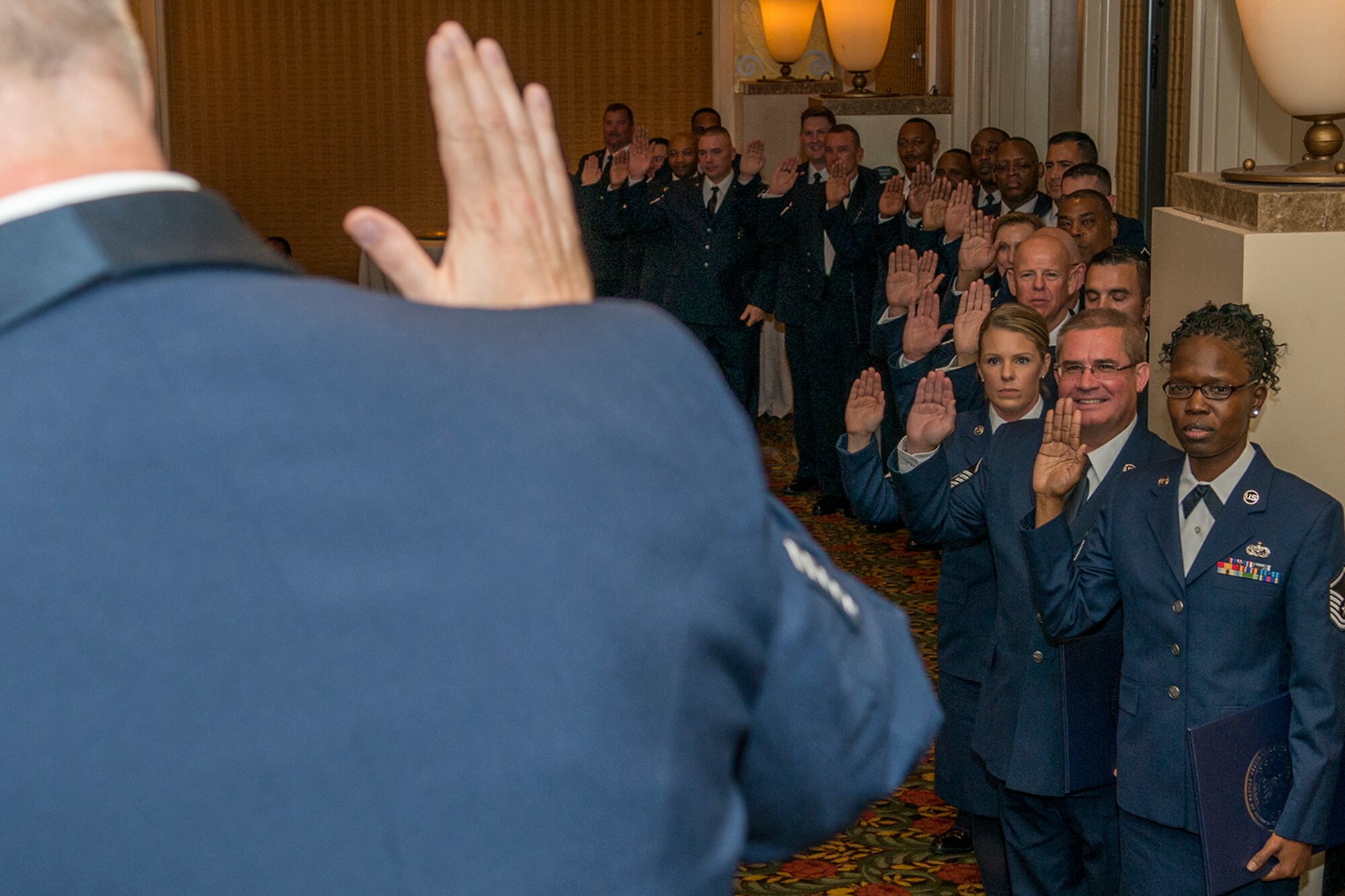 U.S. Air Force Chief Master Sgt. Steven Vogle leads a group of newly promoted Master Sergeants through the Senior Noncommissioned Officer Oath of Induction on Nov. 7, 2015, Shreveport, La. The 307th Bomb Wing Senior Noncommissioned Officer Induction Ceremony is an annual event held to recognize Airmen who were recently promoted to the rank of Master Sergeant. (U.S. Air Force photo by Master Sgt. Greg Steele/Released)