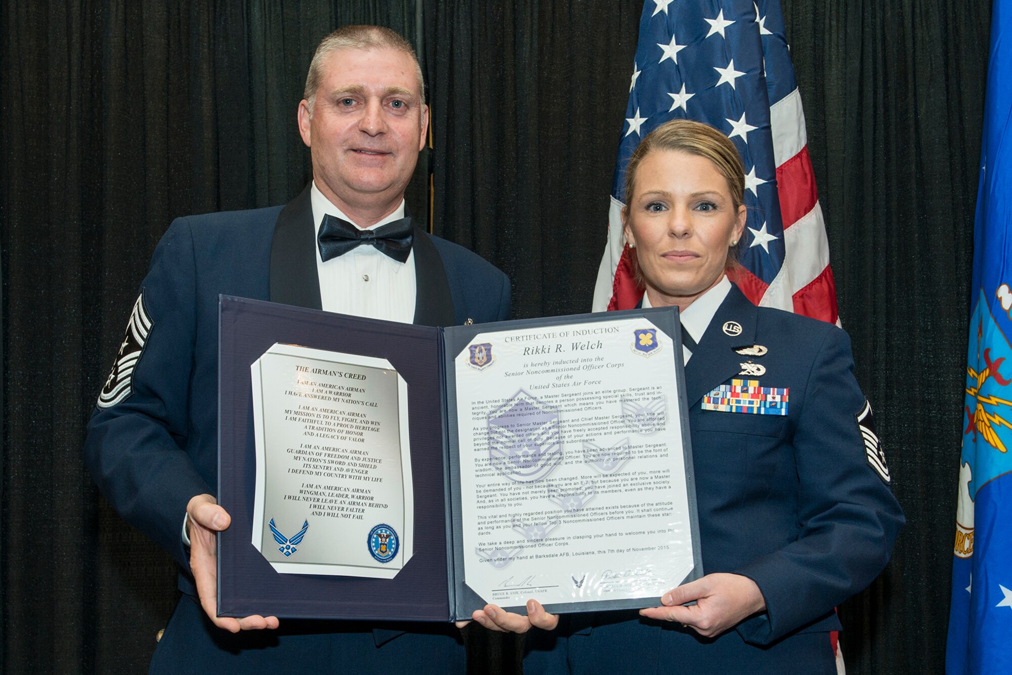 U.S. Air Force Master Sgt. Rikki Welch is presented the Certificate of Induction during a ceremony on Nov. 7, 2015, Shreveport, La. The 307th Bomb Wing Senior Noncommissioned Officer Induction Ceremony is an annual event held to recognize Airmen who were recently promoted to the rank of Master Sergeant. (U.S. Air Force photo by Master Sgt. Greg Steele/Released)