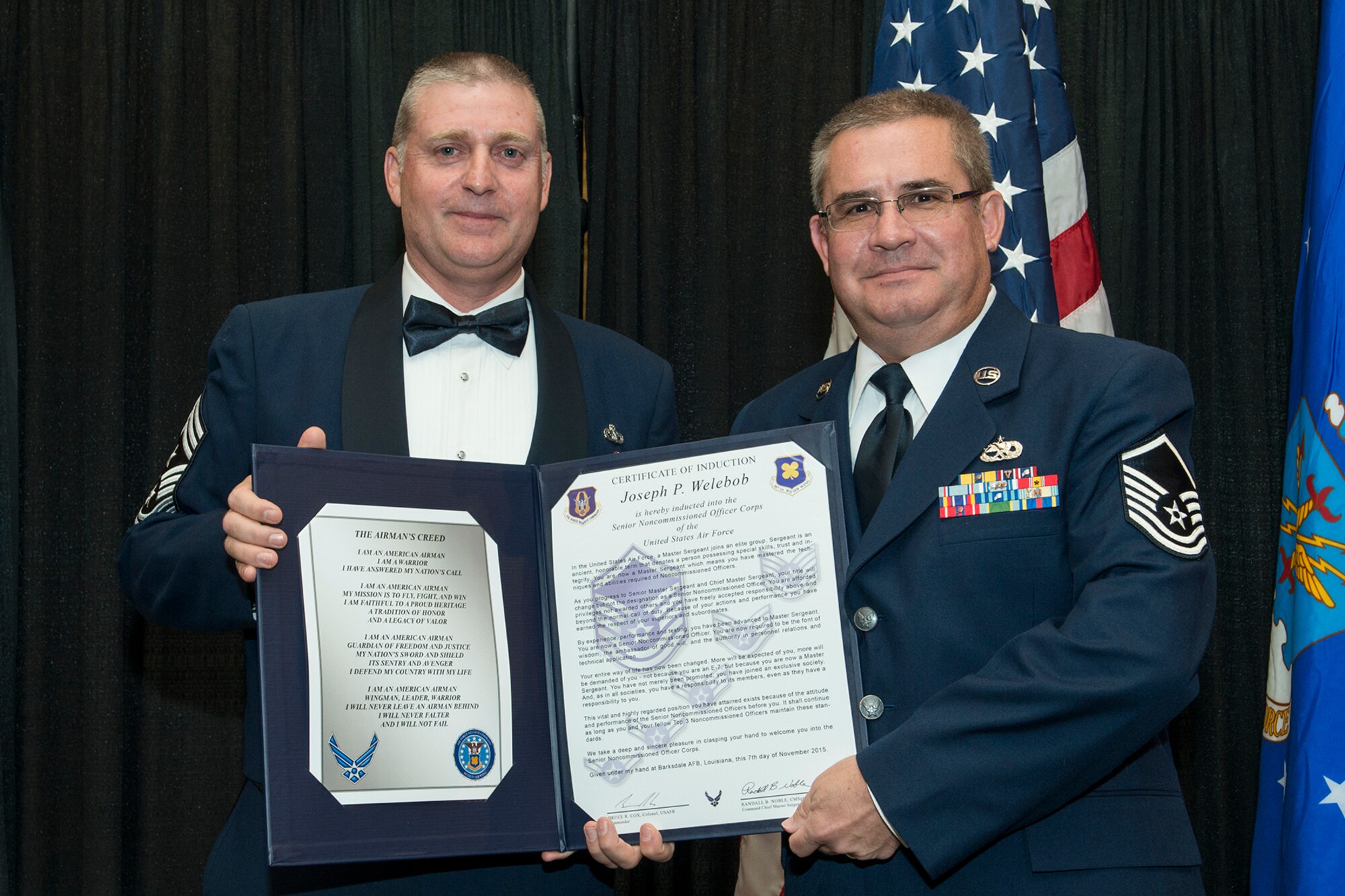 U.S. Air Force Master Sgt. Joseph Welebob is presented the Certificate of Induction during a ceremony on Nov. 7, 2015, Shreveport, La. The 307th Bomb Wing Senior Noncommissioned Officer Induction Ceremony is an annual event held to recognize Airmen who were recently promoted to the rank of Master Sergeant. (U.S. Air Force photo by Master Sgt. Greg Steele/Released)