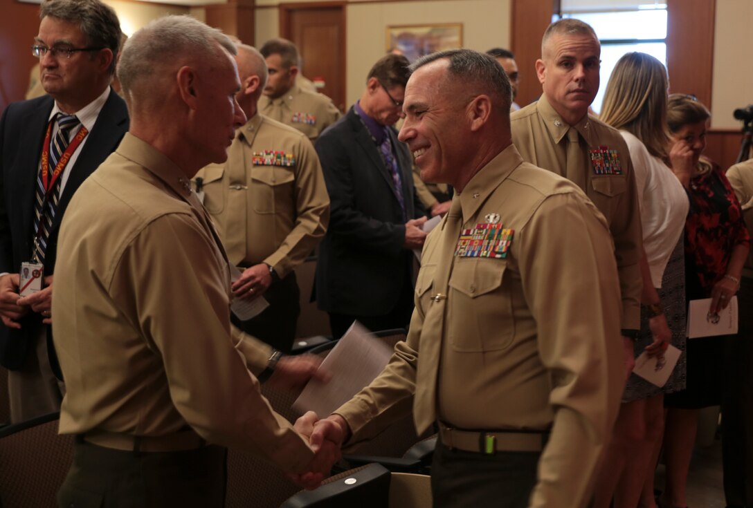 Lt. Gen. Rex C. McMillian (left), commander of Marine Forces Reserve and Marine Forces North, welcomes Brig. Gen. Paul K. Lebidine (right), incoming 4th Marine Division commanding general, during the 4th Marine Division assumption of command ceremony held at Marine Corps Support Facility New Orleans, La, Nov. 13, 2015. As the new commanding general for 4th Marine Division, Lebidine is now responsible for five battalions, three regiments and three companies. (U.S Marine Corps photo by Cpl. Ian Ferro)