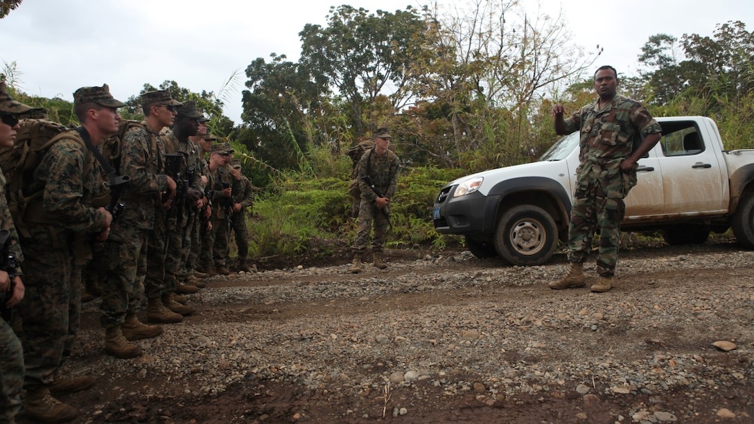 Maj. Henry Macomber, a commander with the Republic of Fiji Military Force, addresses Marines of KOA MOANA 15-3 prior to a training exercise in Namosi Province, Fiji, Oct. 11. Marines and members of the RFMF conducted jungle training exercises, jungle survival and community projects during the week. 