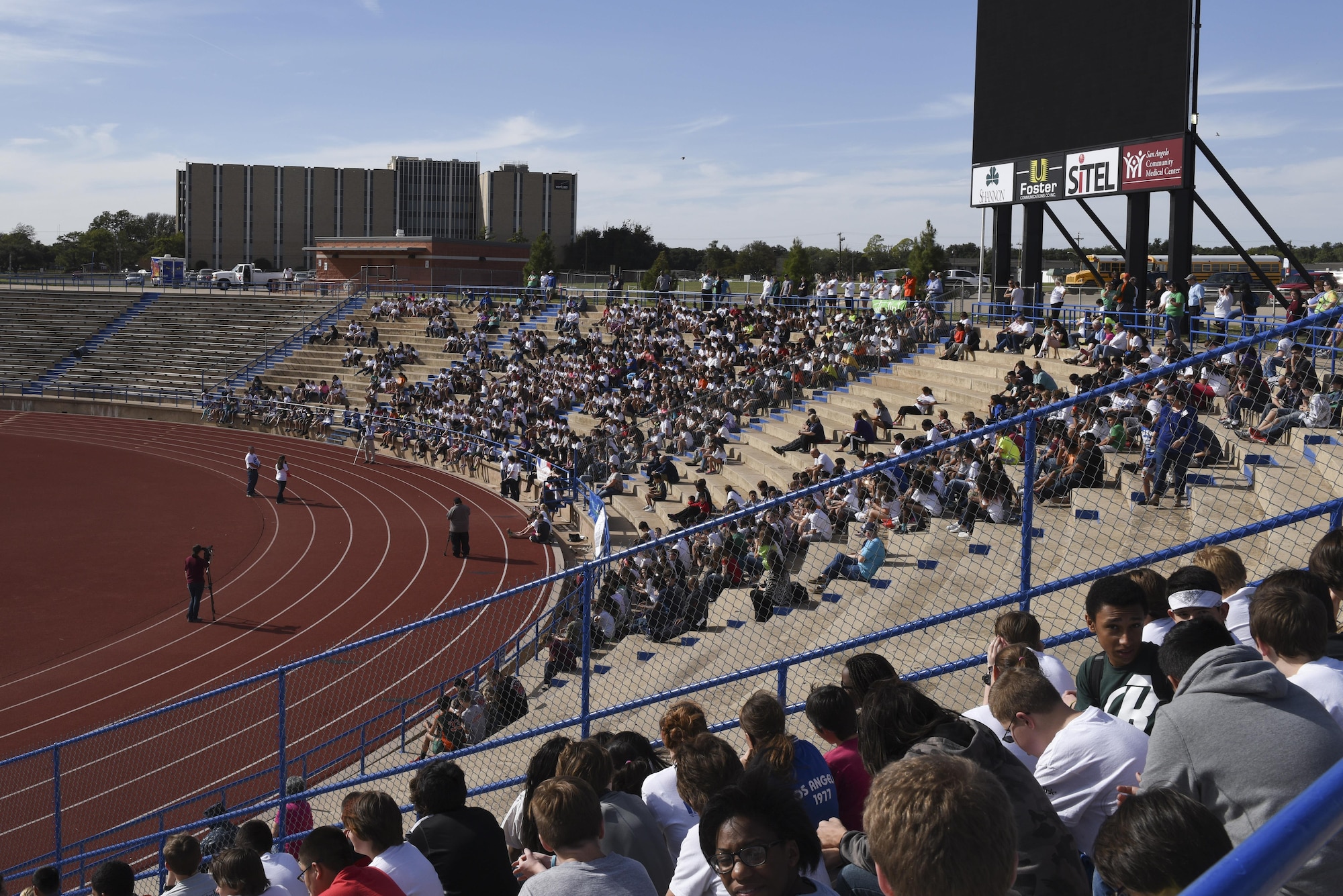 Spectators wait for the Take a Veteran to School event at the San Angelo Stadium in San Angelo, Texas, Nov. 11, 2015. The event honored veterans through military demonstrations and guest speakers. (U.S. Air Force photo by Airman Chase Sousa/Released)
