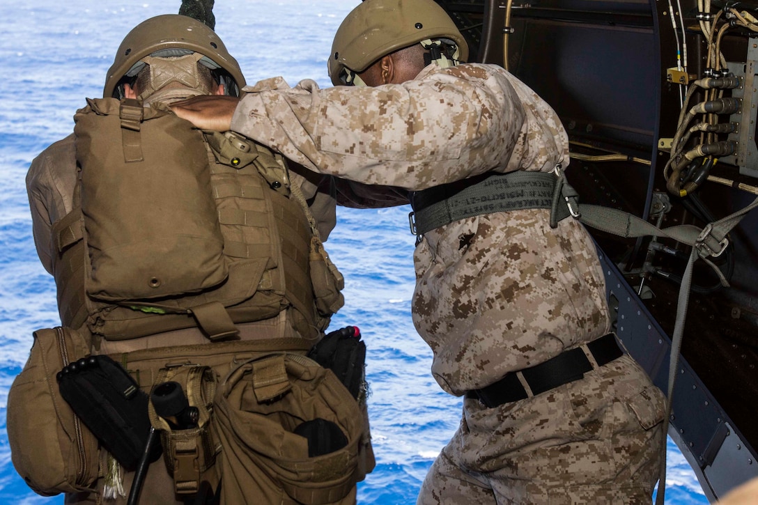 U.S. Marines conduct static fast-rope training aboard the amphibious assault ship USS Kearsarge in the northern Red Sea, Nov. 3, 2015. The Marines are assigned to Weapons Company, Battalion Landing Team 2, 6th Battalion, 26th Marine Expeditionary Unit. The unit is deployed to maintain regional security in the U.S. 5th Fleet area of responsibility. U.S. Marine Corps photo by Cpl. Jalen D. Phillips