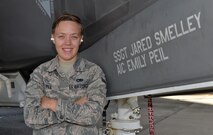 Airman 1st Class Emily Peil, 33rd Aircraft Maintenance Squadron crew chief, stands with the jet that bears her name at Eglin Air Force Base, Fla., Oct. 8, 2015. Peil is one of the first crew chiefs to begin her career on the fifth generation F-35A Lightning II straight from technical school. (U.S. Air Force Photo/Senior Airman Andrea Posey)