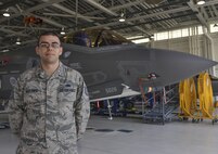 Tech. Sgt. Vicente Martinez, 33rd Aircraft Maintenance Squadron training monitor, stands with the F-35A Lightning II at Eglin Air Force Base, Fla., Oct. 8, 2015. As a veteran crew chief of 10 years, Martinez transferred from F-16 Fighting Falcons to the F-35. (U.S. Air Force Photo/Senior Airman Andrea Posey)