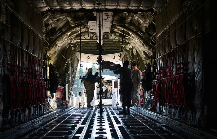 Airmen from the 374th Medical Group practice transporting simulated injured personnel from a C-130J Super Hercules, assigned to the California Air National Guard 146th Airlift Wing, for a medical evacuation training scenario during a medical evacuation training scenario at Yokota Air Base, Japan, Nov. 4, 2015. The medevac training consisted of litter carry scenarios, an obstacle course and high-deck patient loading platform vehicle training. As the Western Pacific mobility hub, Yokota Air Base will be a key location in the event of regional instability, and this exercise gives the installation a chance to test those capabilities in a realistic scenario. 