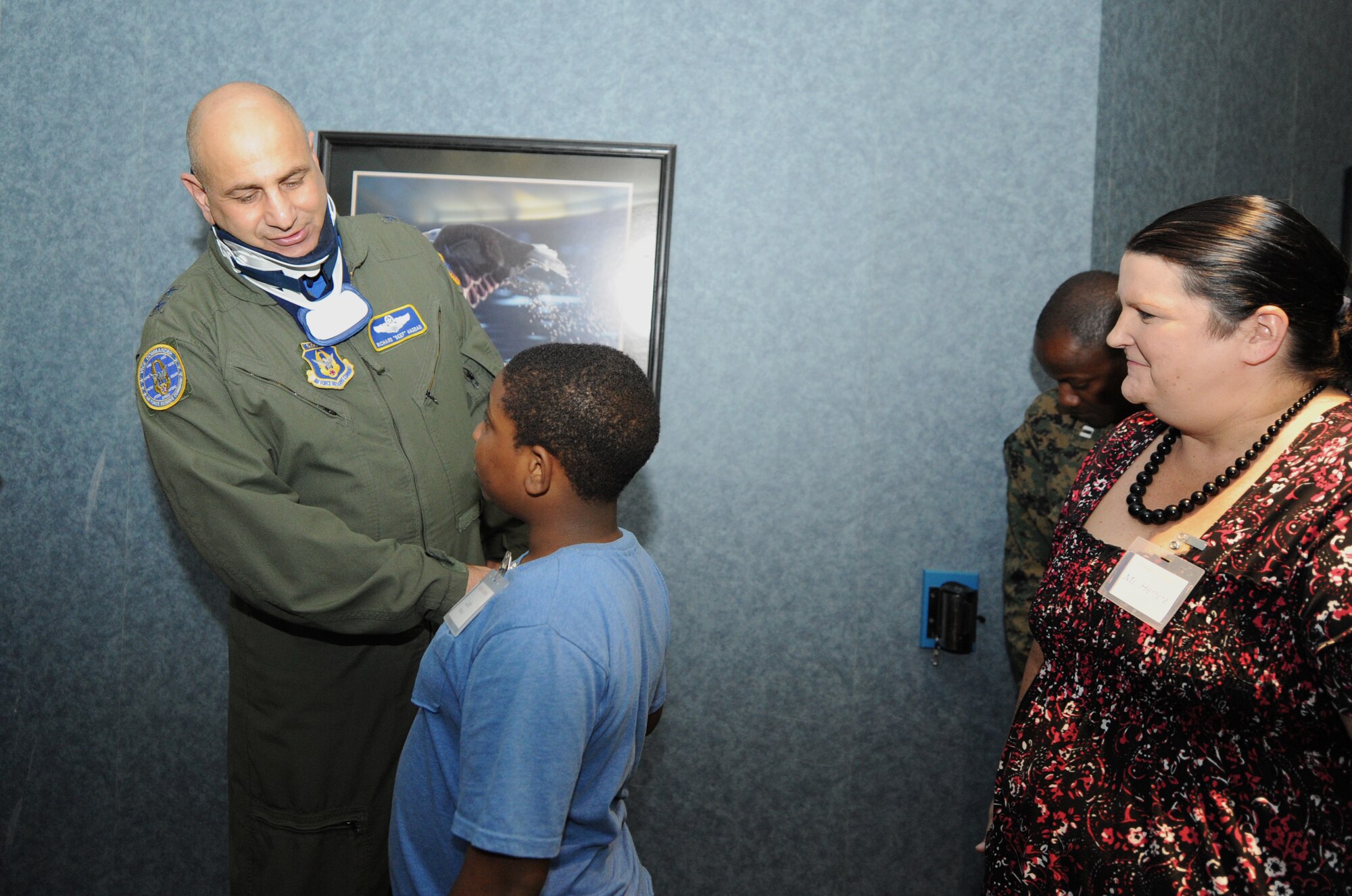 Maj. Gen. Richard Haddad, Air Force Reserve Command vice commander, introduces himself to a STARBASE Robins student Nov. 6, 2015 at the Museum of Aviation, Robins Air Force Base, Georgia. AFRC sponsors STARBASE Robins, as well as the programs located at Nellis AFB, Nevada; Kelly Field Annex, Texas; and Barksdale AFB, Louisiana. (U.S. Air Force photo by Staff Sgt. Sarah Hanson/RELEASED)