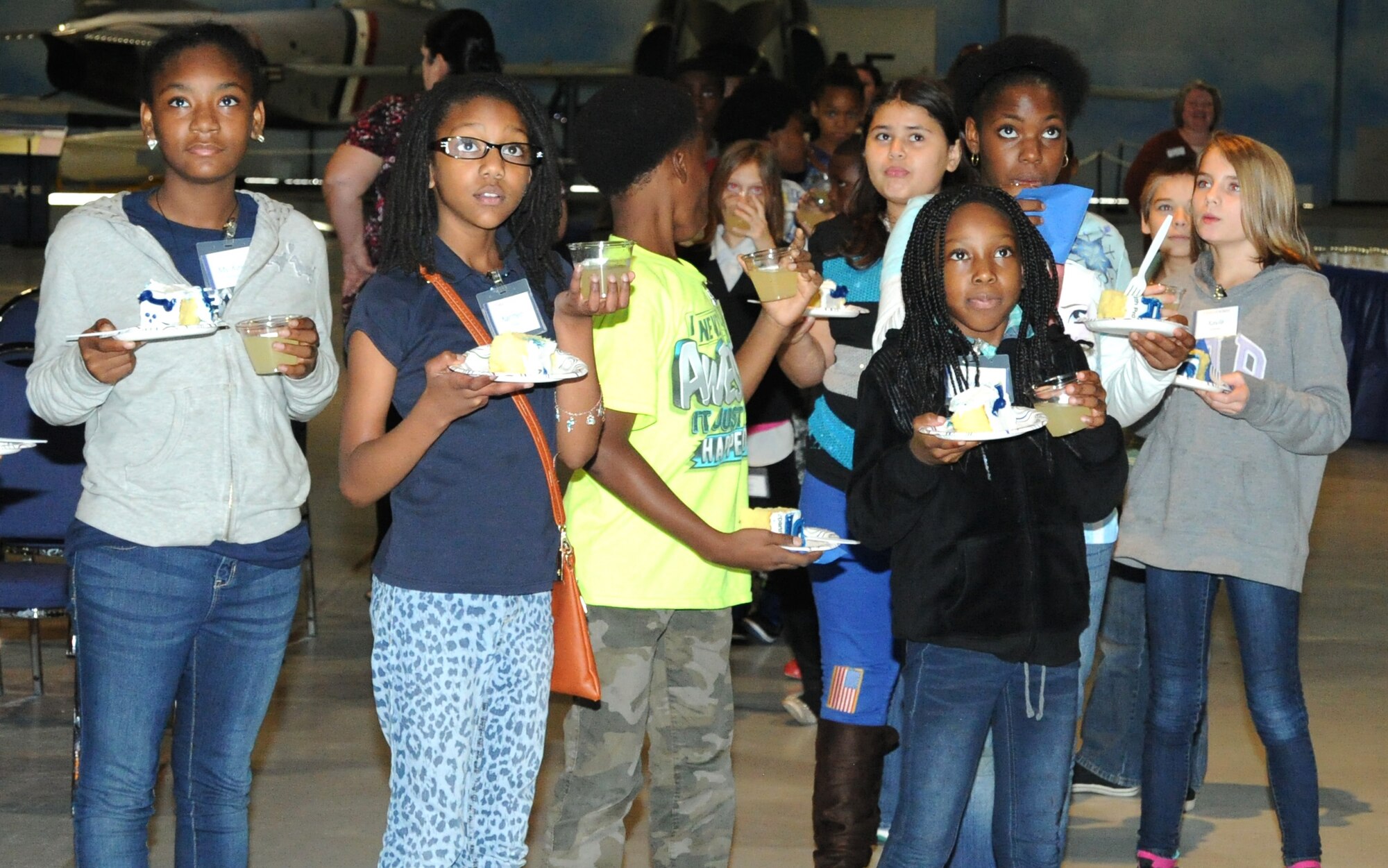 STARBASE Robins students watch photos on a slideshow of the past 20 school years Nov. 6, 2015 at the Museum of Aviation, Robins Air Force Base, Georgia. STARBASE Robins staff, students, teachers and Air Force Reserve Command leadership gathered to celebrate the program's 20th anniversary. (U.S. Air Force photo by Staff Sgt. Sarah Hanson/RELEASED)