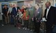 Maj. Gen. Richard Haddad, Air Force Reserve Command vice commander, Wesley Fondal, STARBASE Robins director, and others celebrate the addition of four new classrooms Nov. 6, 2015 at the Museum of Aviation, Robins Air Force Base, Georgia. The new classrooms will allow STARBASE Robins to take on additional schools, which means more students can participate in the program's hands-on educational activities. (U.S. Air Force photo by Staff Sgt. Sarah Hanson/RELEASED)