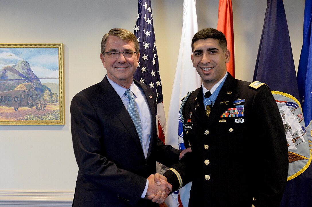 Defense Secretary Ash Carter stops for a photograph with Medal of Honor recipient, retired Army Capt. Florent A. Groberg, before the Hall of Heroes induction ceremony at the Pentagon, Nov. 13, 2015. DoD photo by U.S. Army Sgt. 1st Class Clydell Kinchen