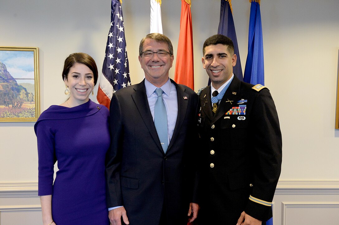 Defense Secretary Ash Carter stops for a photograph with Medal of Honor recipient, retired Army Capt. Florent A. Groberg and his wife, before a Hall of Heroes induction ceremony at the Pentagon, Nov. 13, 2015. DoD photo by Army Sgt. 1st Class Clydell Kinchen