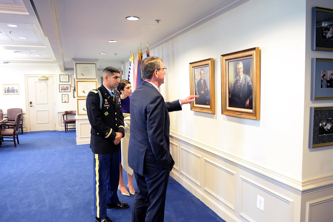 Defense Secretary Ash Carter speaks with Medal of Honor recipient, retired Army Capt. Florent A. Groberg and his wife, before the Hall of Heroes induction ceremony at the Pentagon, Nov. 13, 2015. DoD photo by Army Sgt. 1st Class Clydell Kinchen