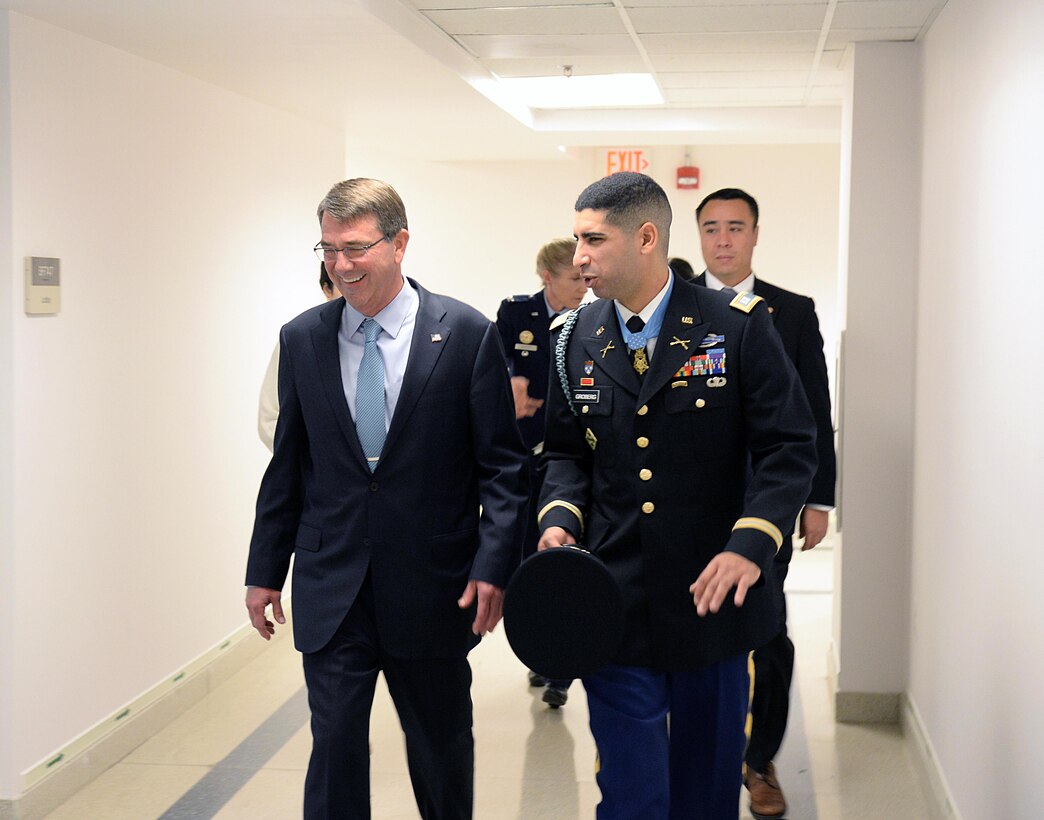 Defense Secretary Ash Carter escorts retired Army Capt. Florent A. Groberg, a Medal of Honor recipient, to his Hall of Heroes induction ceremony at the Pentagon, Nov. 13, 2015. DoD photo by Army Sgt. 1st Class Clydell Kinchen