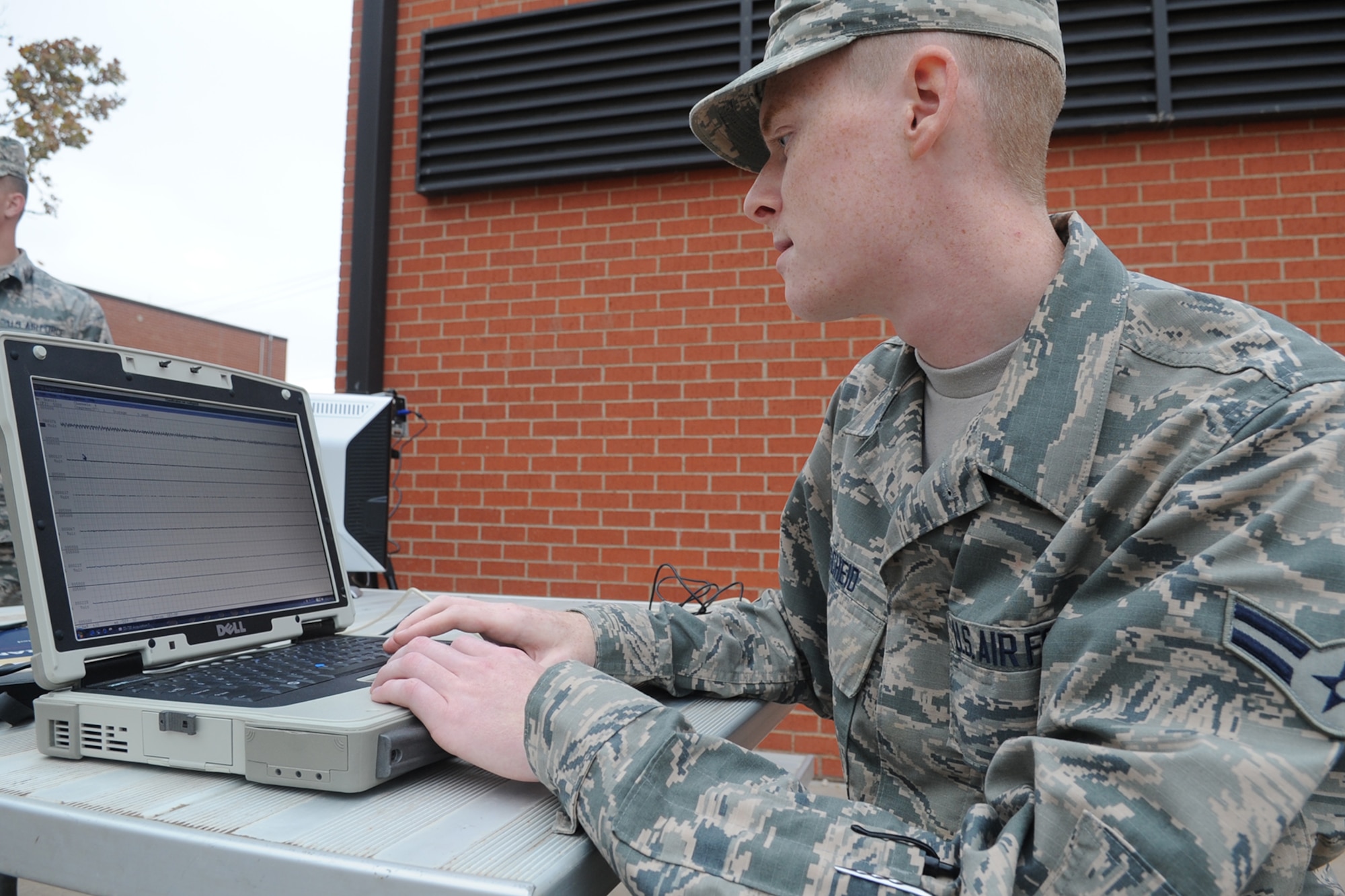 Airman 1st Class Cody L. Eischeid, 312th Training Squadron Special Instruments Training student, tracks ground movement during a collection exercise at Goodfellow Air Force Base, Texas, Nov. 10, 2015. The exercise was the last evaluation needed for Class 16-001 students to graduate. (U.S. Air Force photo by Staff Sgt. Laura R. McFarlane/Released)