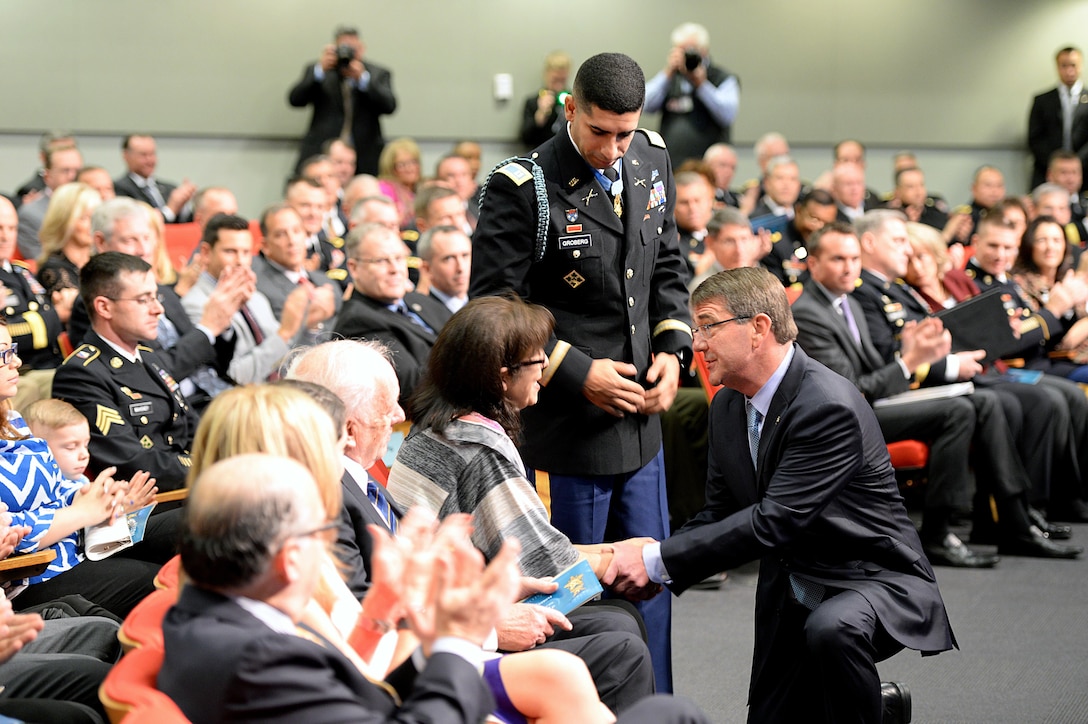 Defense Secretary Ash Carter shakes hands with Klara Groberg, the mother of Medal of Honor recipient, retired Army Capt. Florent A. Groberg during his Hall of Heroes induction ceremony at the Pentagon, Nov. 13, 2015. DoD photo by Army Sgt. 1st Class Clydell Kinchen