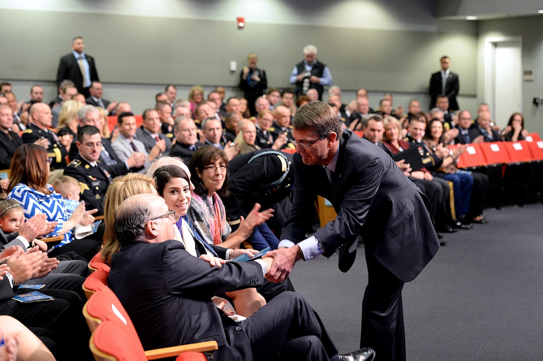 Defense Secretary Ash Carter shakes hands with Medal of Honor recipient, retired Army Capt. Florent A. Groberg's family members at his Hall of Heroes induction ceremony at the Pentagon, Nov. 13, 2015. DoD photo by Army Sgt. 1st Class Clydell Kinchen