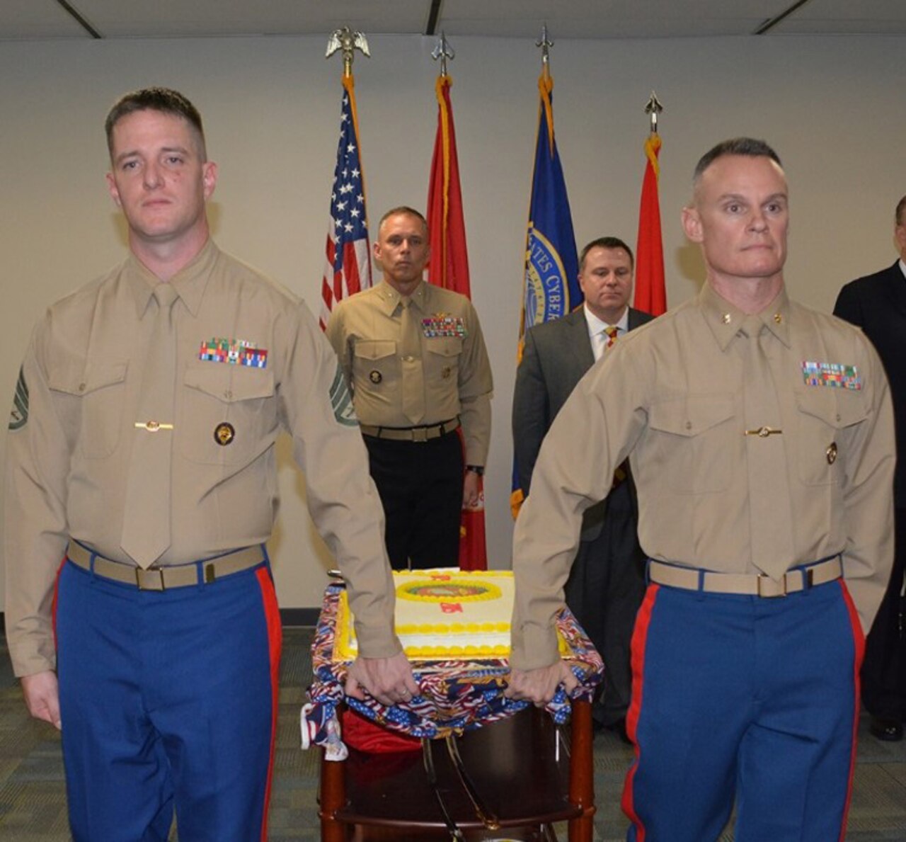 Men and women from the Marine element at U.S. Cyber Command headquarters joined Marine Brig. Gen. Matthew Glavy and Marine Col. Andrew Moyer to celebrate the 240th birthday of the U.S. Marine Corps at U.S. Cyber Command headquarters on Fort Meade, Md., Nov. 10, 2015. The cake is representative of the knowledge and experience shared between Marine Corps members, -- past present and future. Courtesy photo