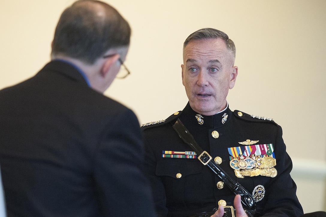 Marine Corps Gen. Joseph F. Dunford Jr., chairman of the Joint Chiefs of Staff, talks with Brian McQuarry, a Boston Globe editorial board member, in Boston, Nov. 13, 2015. DoD photo by Navy Petty Officer 2nd Class Dominique A. Pineiro