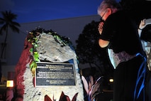 151110-N-IU636-952 HONOLULU (Nov. 10, 2015) A woman bows her head in front of the new war memorial plaque unveiled at the Neal S. Blaisdell Center in Honolulu during a war memorial plaque rededication ceremony. The ceremony served to remember, preserve and rededicate the center as a war memorial with the unveiling of a new memorial plaque. The original plaque is believed to have gone missing some time by 1970. On Sept. 12, 1964, the Neal S. Blaisdell Center, formerly the Honolulu International Center, was dedicated as a living memorial to all of Hawaii's war veterans and war dead. (U.S. Navy photo by Mass Communication Specialist 2nd Class Johans Chavarro/Released)