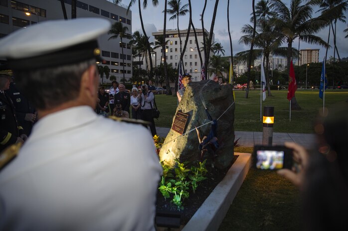 Adm. Harry Harris, U.S. Pacific Command commander, pulls the cover off the new plaque at the Neal S. Blaisdell War Memorial Plaque Rededication Ceremony in Honolulu, Nov. 10, 2015. Harris was one of the guest speakers for the ceremony in which he stated, “Any nation that does not honor its heroes will not endure.” The Neal S. Blaisdell Center was dedicated as a war memorial in 1964, but its plaque went missing. The new plaque was dedicated to revitalize and preserve the war memorial heritage. (U.S. Marine Corps photo by Lance Cpl. Jonathan E. LopezCruet)