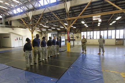 Lt. Col. Todd J. Allison, talks with 8th Theater Sustainment Command Soldiers during Modern Army Combatives Program training Level 1, Aug, 24-28, 2015, at the 8th STB Warrior Training Center, Fort Shafter Flats, Hawaii. The unit reestablished its combatives program as a way to emphasis combat readiness and Soldier development. (U.S. Army photo by Sgt. Jon Heinrich/RELEASED)
