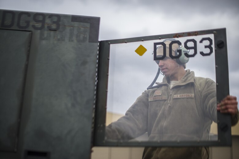 Airman 1st Class Michael Abreu, 455th Expeditionary Aircraft Maintenance Squadron electrical and environmental systems technician, deployed from Dyess Air Force Base, Texas, powers on a generator to test an air conditioning unit on a C-130 Hercules at Bagram Air Field, Afghanistan, Nov. 11, 2015. The 455th EAMXS is responsible for repairing and maintaining military aircraft on Bagram, as well as performing preventative maintenance inspections. (U.S. Air Force photo/Tech. Sgt. Robert Cloys/RELEASED)