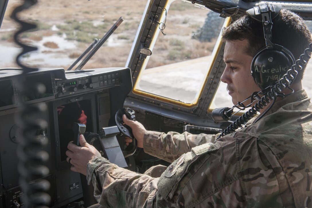 Staff Sgt. Andrew Greulich, 455th Expeditionary Aircraft Maintenance Squadron communications navigation systems technician, deployed from Dyess Air Force Base, Texas, troubleshoots a communications system on a C-130 at Bagram Airfield, Afghanistan, Nov. 13, 2015. The 455th EAMXS is responsible for repairing and maintaining military aircraft on Bagram, as well as performing preventative maintenance inspections.(U.S. Air Force photo/Tech. Sgt. Robert Cloys/RELEASED)