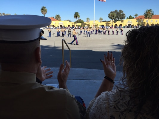 Marine Corps Sgt. Maj. Bryan B. Battaglia, the senior enlisted advisor to the chairman of the Joint Chiefs of Staff, and his wife, Lisa, applaud as the Marine Corps Recruit Depot San Diego band performs during a graduation ceremony at the depot in San Diego, Nov. 13, 2015. DoD photo by Claudette Roulo