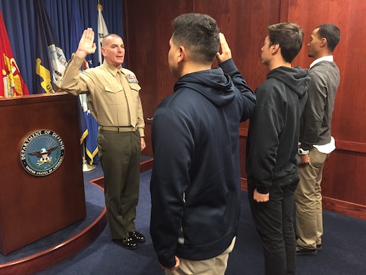 Marine Corps Sgt. Maj. Bryan B. Battaglia, the senior enlisted advisor to the chairman of the Joint Chiefs of Staff, administers the oath of enlistment to new recruits at the San Diego Military Entrance Processing Station in San Diego, Nov. 12, 2015. DoD photo by Claudette Roulo