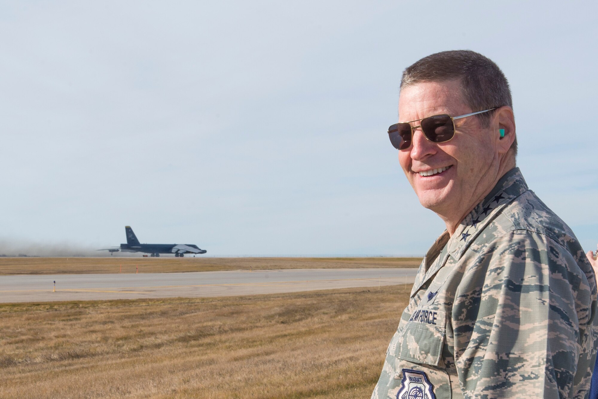 U.S. Air Force Gen. Robin Rand, Air Force Global Strike Command (AFGSC) commander, observes a B-52 Stratofortress bomber taking off from the flight line at Minot Air Force Base, N.D., Nov. 8, 2015, during Exercise GLOBAL THUNDER 16. AFGSC supports USSTRATCOM’s global strike and nuclear deterrence missions by providing strategic assets, including bombers like the B-52 and B-2, to ensure a safe, secure, effective and ready deterrent force. GLOBAL THUNDER is an annual U.S. Strategic Command training event that assesses command and control functionality in all USSTRATCOM mission areas and affords component commands a venue to evaluate their joint operational readiness. Planning for GLOBAL THUNDER 16 has been underway for more than a year and is based on a notional scenario with fictitious adversaries. One of nine DoD unified combatant commands, USSTRATCOM has global strategic missions, assigned through the Unified Command Plan, which also include; space operations; cyberspace operations; joint electronic warfare; missile defense; intelligence, surveillance and reconnaissance; combating weapons of mass destruction; and analysis and targeting. (U.S. Air Force photo by Airman 1st Class Justin Armstong)