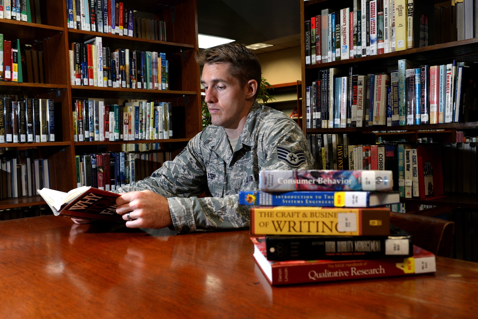 Staff Sgt. Joshua Stepp, 36th Maintenance Group quality assurance evaluator, studies at the base library Nov. 6, 2015, at Andersen Air Force Base, Guam. In fiscal 2015, more than 170 Airmen here graduated with either their associate’s, bachelor’s or master’s degree, making Andersen AFB No. 1 for education in the Pacific Air Forces region. (U.S. Air Force photo by Airman 1st Class Alexa Ann Henderson/Released)