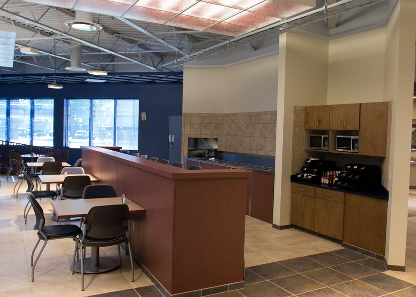Chairs and tables rest in the Georgia Pines Dining Facility, Nov. 13, 2015, at Moody Air Force Base, Ga. Georgia Pines will feature a conveyor belt that will take trays and dishes to the back to be cleaned. (U.S. Air Force photo/Tech. Sgt. Zachary Wolf)