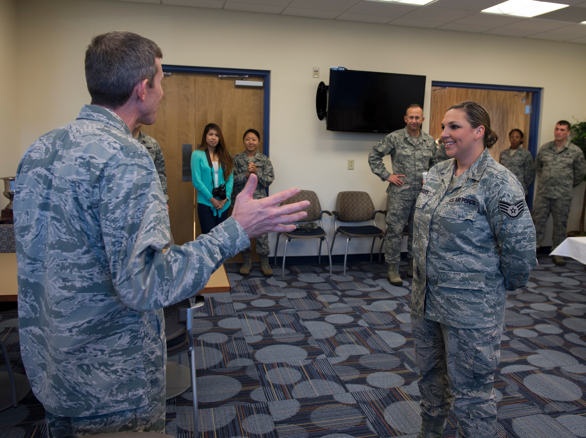 Col. Thomas Kunkel, 23d Wing commander, thanks Staff Sgt. Megan Rodgers, 23d Force Support Squadron, for the tour after the Georgia Pines Dining Facility ribbon cutting ceremony, Nov. 13, 2015, at Moody Air Force Base, Ga. The dining facility will serve all active-duty enlisted members everyday and officers, retirees and families on weekends and holidays. (U.S. Air Force photo/Tech. Sgt. Zachary Wolf)