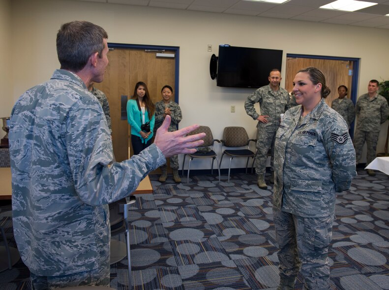 Col. Thomas Kunkel, 23d Wing commander, thanks Staff Sgt. Megan Rodgers, 23d Force Support Squadron, for the tour after the Georgia Pines Dining Facility ribbon cutting ceremony, Nov. 13, 2015, at Moody Air Force Base, Ga. The dining facility will serve all active-duty enlisted members everyday and retirees and families on weekends and holidays. (U.S. Air Force photo/Tech. Sgt. Zachary Wolf) 

