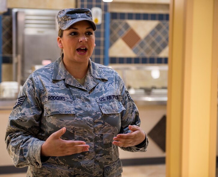 Staff Sgt. Megan Rodgers, 23d Force Support Squadron, briefs everyone before starting a tour of the facility during the Georgia Pines Dining Facility ribbon cutting ceremony, Nov. 13, 2015, at Moody Air Force Base, Ga. Georgia Pines will be serving its first meal Sunday, Nov. 15. (U.S. Air Force photo/Tech. Sgt. Zachary Wolf)