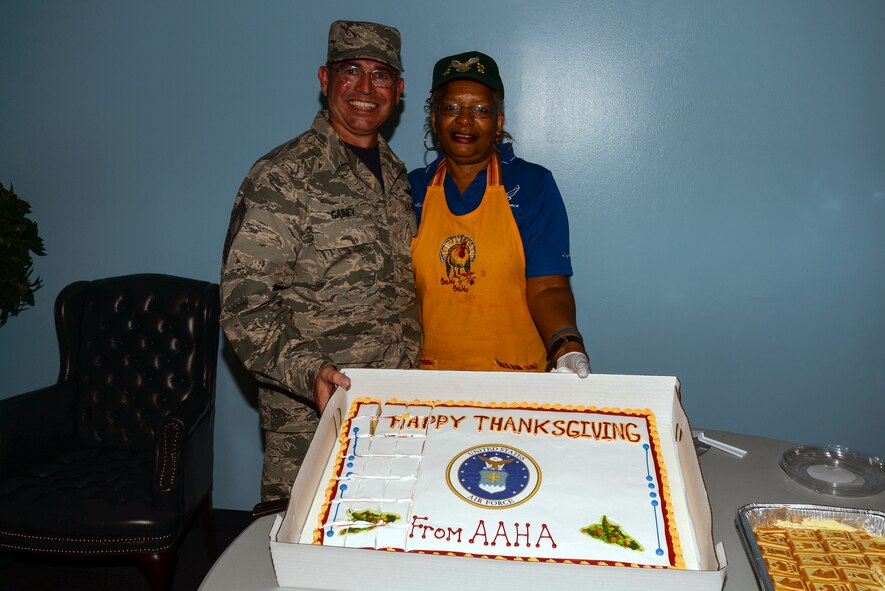 Chief Master Sgt. Maxie Gainey, 347th Rescue Group chief enlisted manager, poses with retired Chief Master Sgt. Leila Brown, 336 Recruiting Squadron recruiter support manager, during the Airmen’s  Thanksgiving Luncheon, Nov. 13, 2015, at Moody Air Force Base, Ga. Gainey and Brown coordinated the event with the intention of letting Airmen know leadership at every level is there for them . (U.S. Air Force photo by Airman 1st Class Janiqua P. Robinson/Released)
