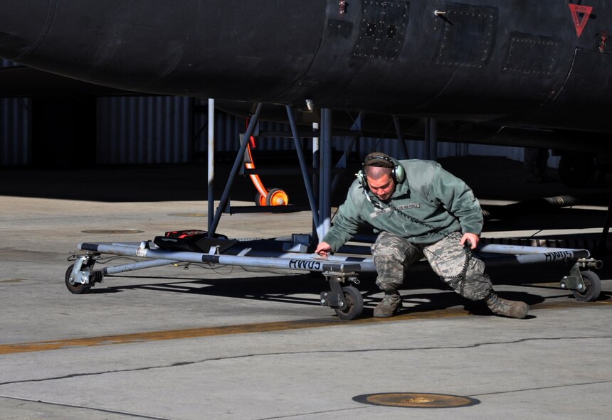 An Airman assigned to the 9th Aircraft Maintenance Squadron prepares a U-2 Dragon Lady for takeoff at Beale Air Force Base, Calif., Nov. 4, 2015, during U.S. Strategic Command’s (USSTRATCOM) Exercise GLOBAL THUNDER 16. Beale AFB is home to the 9th Reconnaissance Wing, which enhances USSTRATCOM’s intelligence, surveillance and reconnaissance mission by providing mission-ready aircraft to detect and deter strategic threats against the U.S. and its allies in support of the command’s Task Force 204. GLOBAL THUNDER is an annual U.S. Strategic Command training event that assesses command and control functionality in all USSTRATCOM mission areas and affords component commands a venue to evaluate their joint operational readiness. Planning for GLOBAL THUNDER 16 has been under way for more than a year and is based on a notional scenario with fictitious adversaries. One of nine DoD unified combatant commands, USSTRATCOM has global strategic missions, assigned through the Unified Command Plan, which also include strategic deterrence; space operations; cyberspace operations; joint electronic warfare; global strike; missile defense; combating weapons of mass destruction; and analysis and targeting. (U.S. Air Force photo by Staff Sgt. Jeffrey M. Schultze)