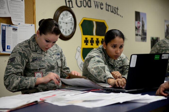 Senior Airman Kelsey Canapary (left), 9th Force Support Squadron reenlistments and extensions technician, reviews deployment eligibility for Airmen Nov. 4, 2015, at Beale Air Force Base, California, during U.S. Strategic Command’s (USSTRATCOM) Exercise GLOBAL THUNDER 16. Beale AFB is home to the 9th Reconnaissance Wing, which enhances USSTRATCOM’s intelligence, surveillance and reconnaissance mission by providing mission-ready aircraft to detect and deter strategic threats against the U.S. and its allies in support of the command’s Task Force 204. GLOBAL THUNDER is an annual U.S. Strategic Command training event that assesses command and control functionality in all USSTRATCOM mission areas and affords component commands a venue to evaluate their joint operational readiness. Planning for GLOBAL THUNDER 16 has been under way for more than a year and is based on a notional scenario with fictitious adversaries. One of nine DoD unified combatant commands, USSTRATCOM has global strategic missions, assigned through the Unified Command Plan, which also include strategic deterrence; space operations; cyberspace operations; joint electronic warfare; global strike; missile defense; combating weapons of mass destruction; and analysis and targeting.  The exercise involved various base agencies practicing readiness techniques for mass deployments. (U.S. Air Force photo by Senior Airman Bobby Cummings)