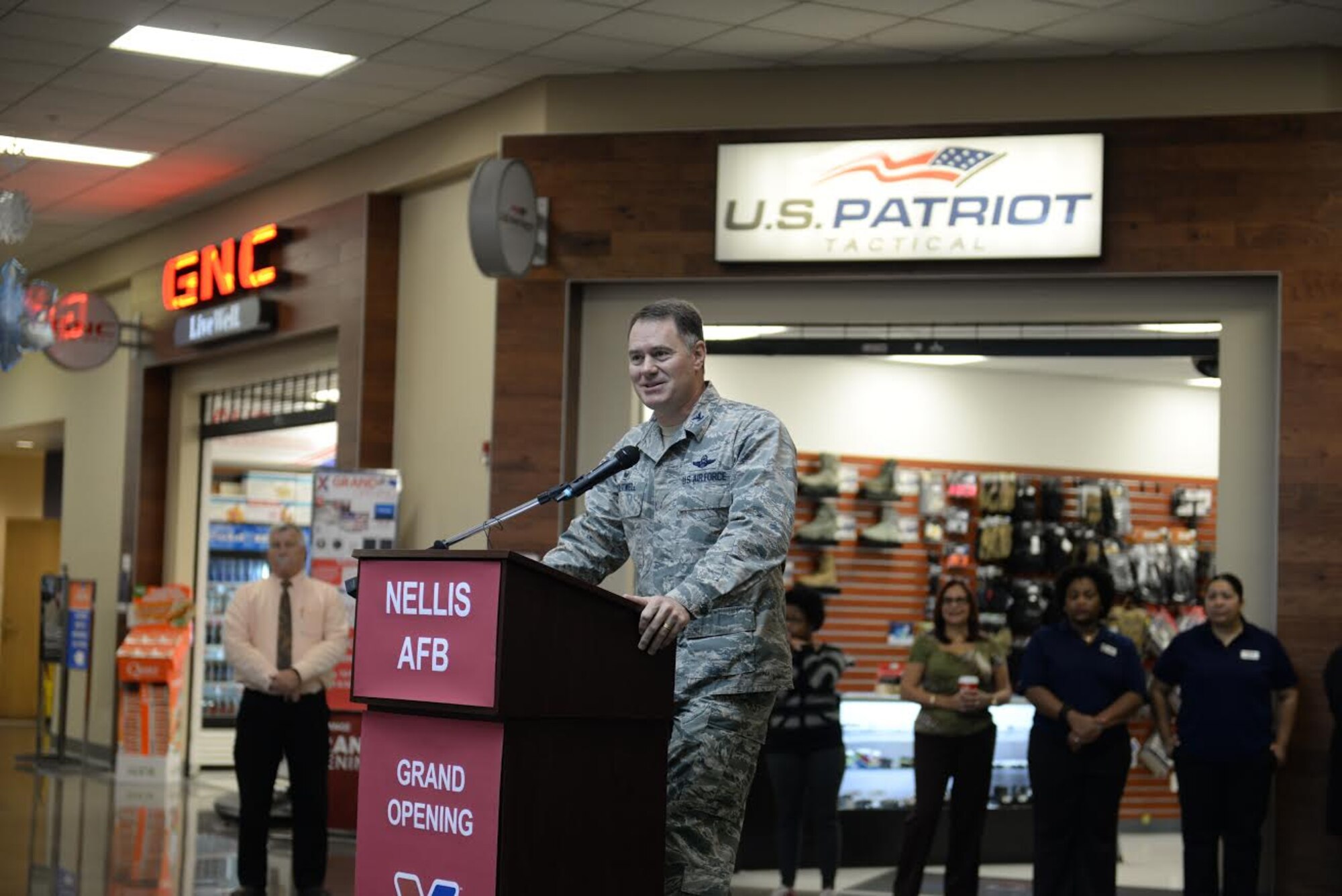 Col. Richard Boutwell, 99th Air Base Wing commander, gives opening remarks at the Exchange on Nellis Air Force Base, Nev., during the grand opening ceremony Nov. 10, 2015. The 221,800 square-foot shopping center experienced its first remodel in 13 years. It features updates to the main store as well as the food court and concessions. (U.S. Air Force photo by Airman 1st Class Rachel Loftis)