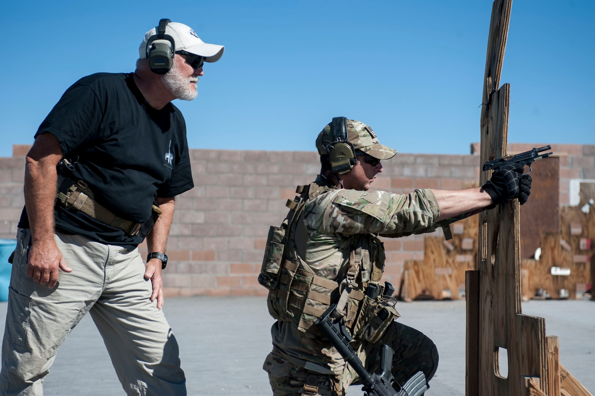 Retired Chief Master Sgt. Paul Koester, 58th Rescue Squadron chief enlisted manager, shadows an Airman participating in a training scenario Oct. 22 at Nellis Air Force Base, Nev. At the time of his retirement, Koester was the oldest enlisted member actively serving in the Air Force, as well as the longest serving Pararescue Airman in history. (U.S. Air Force photo by Airman 1st Class Jake Carter)