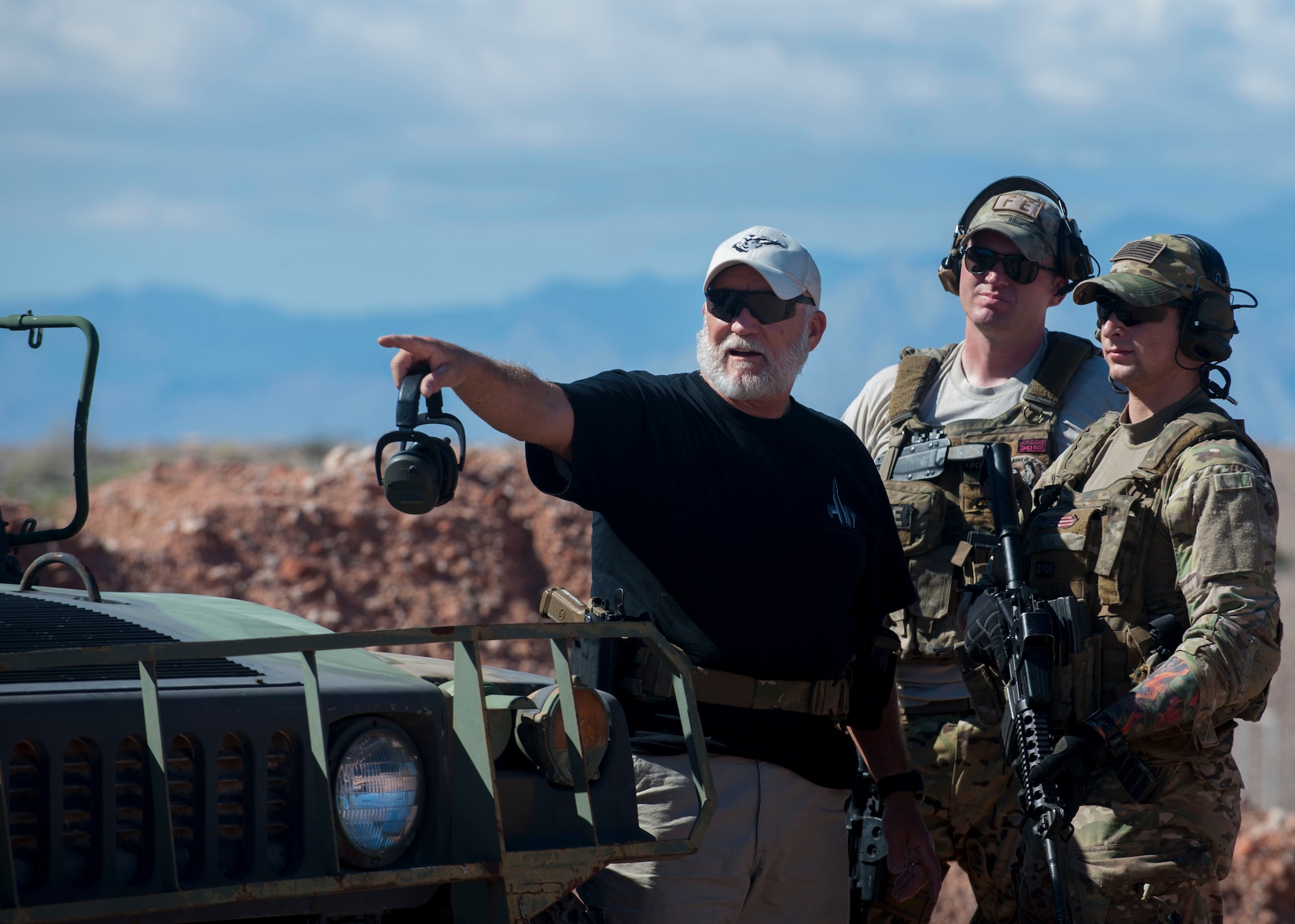 Retired Chief Master Sgt. Paul Koester, 58th Rescue Squadron chief enlisted manager, gives guidance on how to take down a target to Airmen stationed at Nellis Air Force Base, Nev., Oct. 22. Koester retired Oct. 31 after serving 41 years in the Air Force. (U.S. Air Force photo by Airman 1st Class Jake Carter)