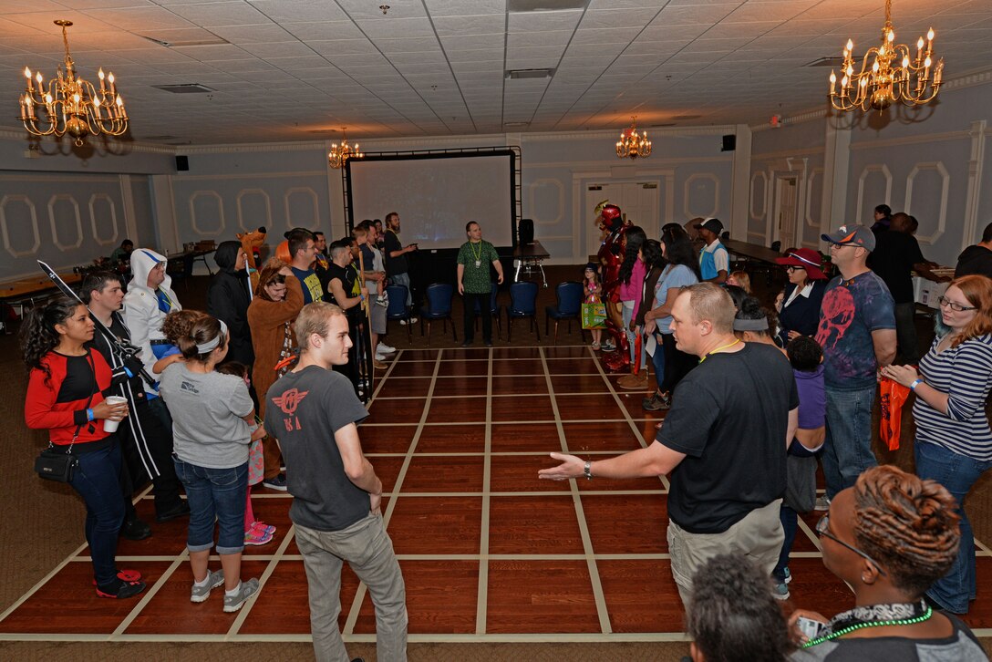 Members of Team Seymour gather to play a game of human chess during the inaugural Seymour Johnson Comic Expo, Nov. 7, 2015, at Seymour Johnson Air Force Base, North Carolina. Human chess is a variation of the game in which individuals play the pieces on a large, life-size board while being controlled by game masters. (U.S. Air Force photo/Airman 1st Class Ashley Williamson)